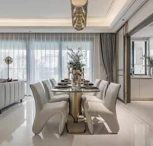 餐厅与客厅以横厅的格局，摆上大理石台面的餐桌，搭配皮质的餐椅摆设，让用餐空间显得情趣舒适而优雅自然。