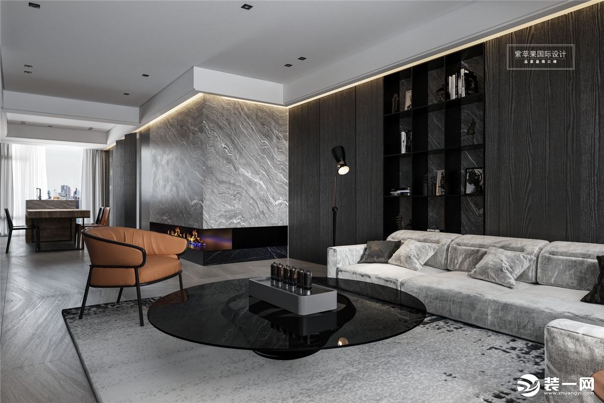 客厅一组灰色的布艺沙发，与整体色调相呼应，L型的区域造型可以容纳家中多人的休息。