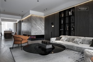 客厅一组灰色的布艺沙发，与整体色调相呼应，L型的区域造型可以容纳家中多人的休息。
