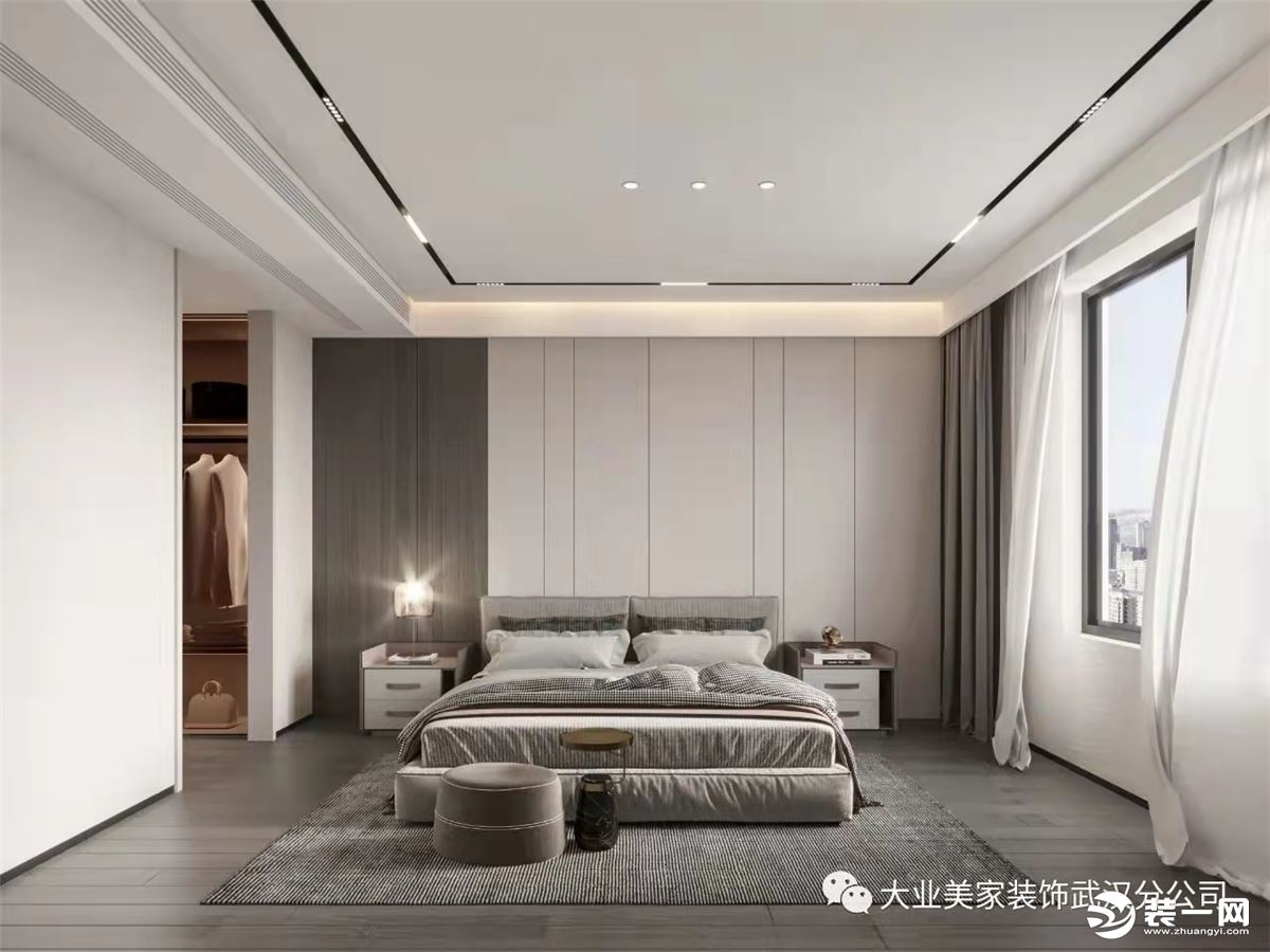 卧室丨主卧延续整体空间风格，灰咖色软包搭配白色的墙板，温和的中性色调让空间散发着一种沉稳安定的情绪
