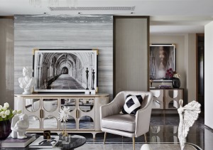 客厅空间以中性色的灰调为主，布置现代的家具陈设，搭配同色调的慵懒沙发，舒适不失鲜活，为客厅营造出一种