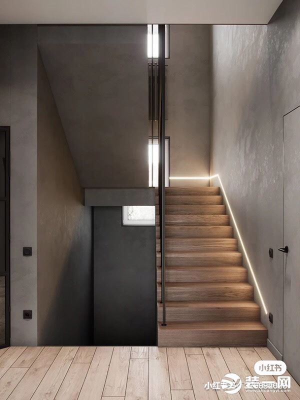 灰色的楼梯过道，同时采用原木的色调搭配，加上灯带的设计，锻铁楼梯扶手，整个空间彰显了简约式风格的特
