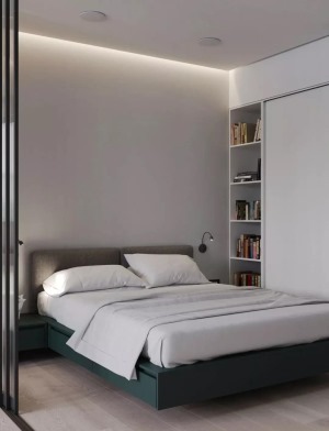 ▲灰色床头靠背，墨绿色床体，搭配一张素白的床单。以入墙衣柜搭配壁龛收纳，营造了简洁明快的卧室格局。