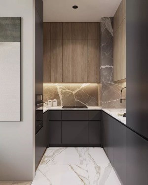 厨房内部是做了L形的橱柜布局方案，白色的墙砖和灰色的地砖搭配灰色的橱柜，让厨房看起来更有层次感又不
