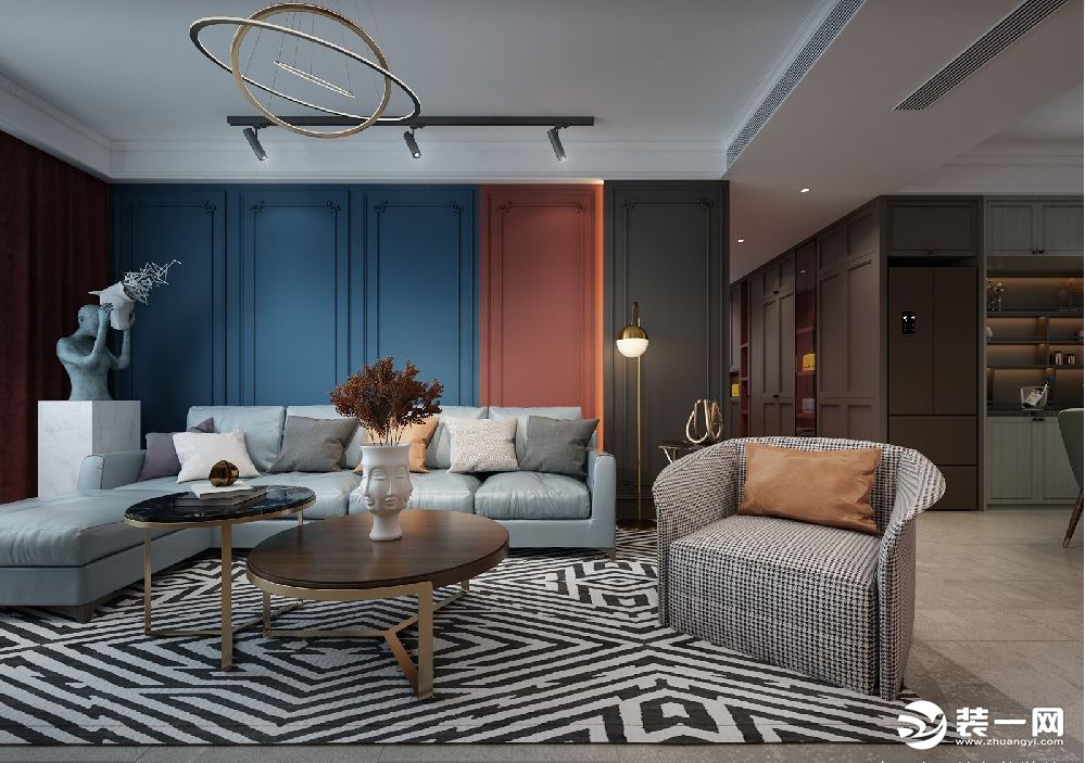 客厅选用以灰为主加上蓝色与红色略显的活泼可爱 ，自然干净的灰色墙体与沉稳安静的木质地板相呼应.