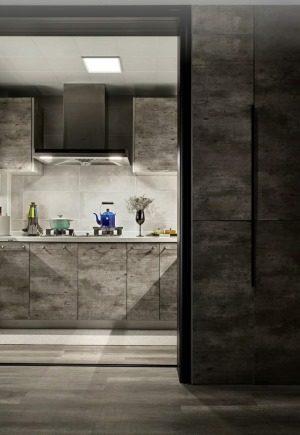 厨房空间的主色调以灰色为主，柜门做旧的材质，营造出工业复古的感觉。