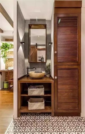 进门的小玄关，除了有上下的鞋柜，还有一个嵌入进去的洗手台空间。