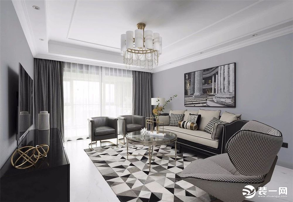 客厅墙面用了灰色的海吉布，衍生出薄雾般的轻柔感，黑白色软装将经典配色运用的淋漓尽致