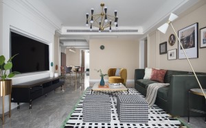 选择现代主题的点状羊毛地毯，在客厅区域形成良好的点线面关系。