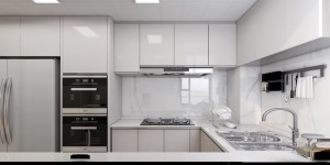 厨房做L型布局设计，以白色为主要设计基调，选用白色为底的泼墨瓷砖做墙面铺贴，搭配白色橱柜，简洁又明亮