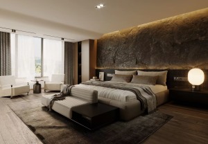 主卧背景墙做与客厅一样的额黑色岩板，搭配浅灰色与奶白色相拼的床体，打造柔和与神秘的碰撞感，整体更具有