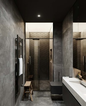 淋浴区的黑色几何背景墙外，却摆放着一张木凳，工业风与传统中国风进行了美妙的融合