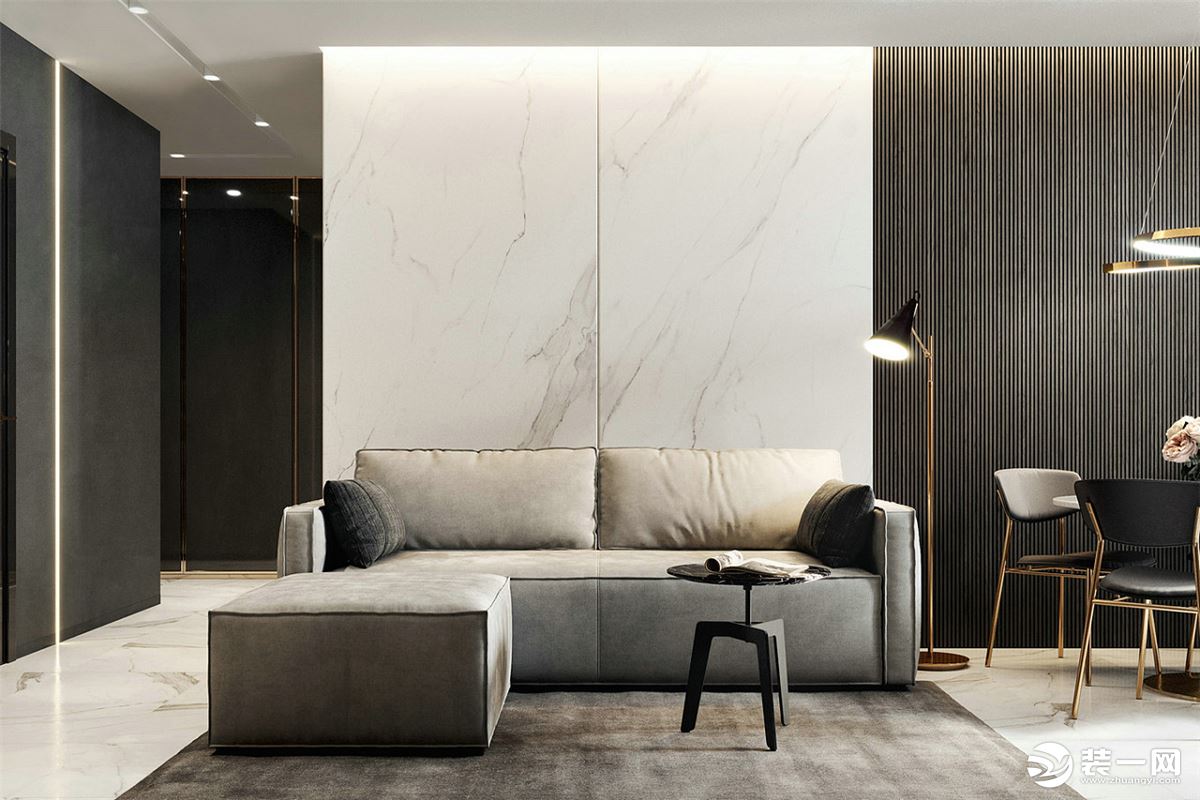 客厅沙发后的背景墙大片留白，却不显单调，分配上灰色的沙发，有一种低调的质感美。