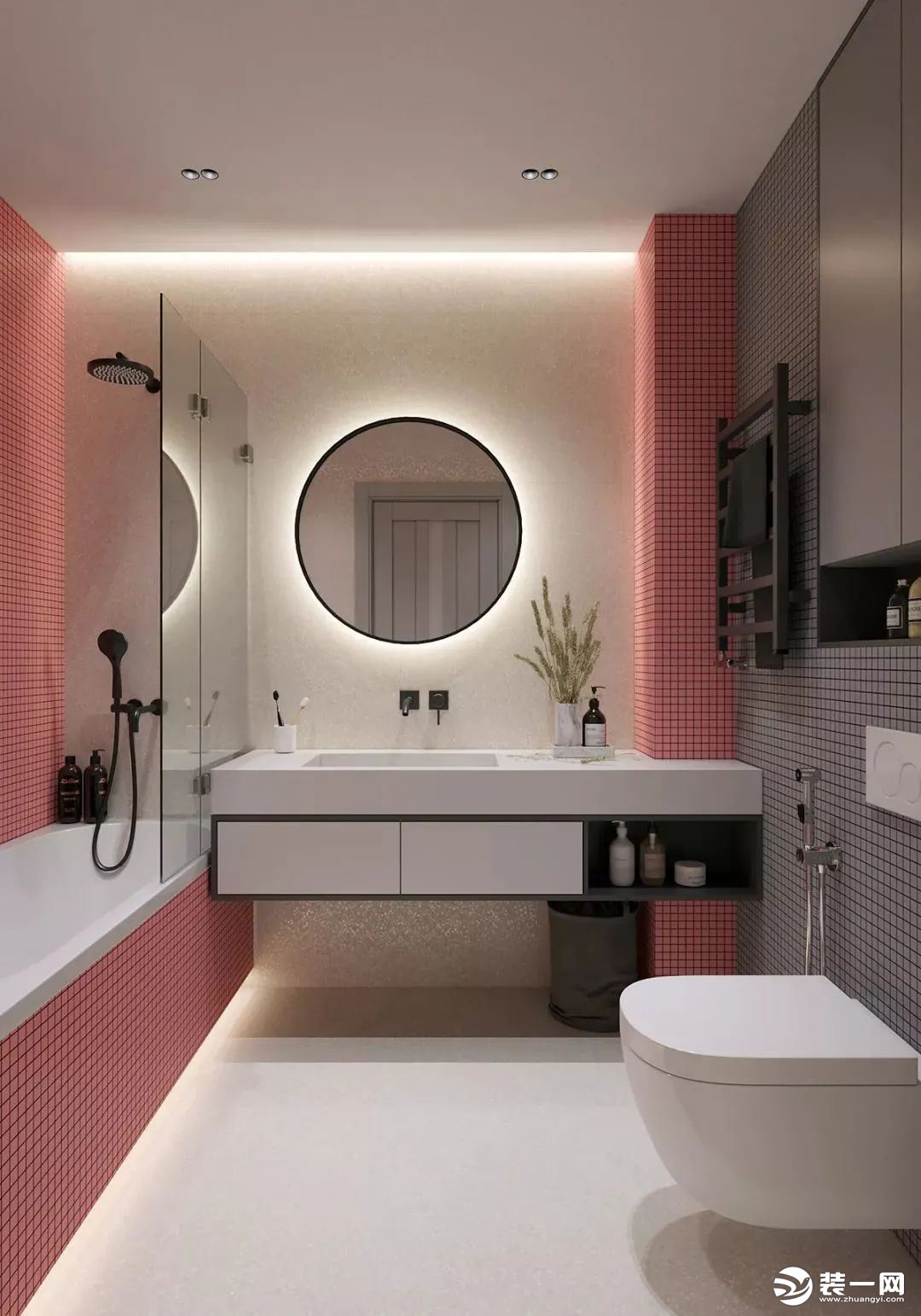 主卫空间设置了浴缸、洗手盆与马桶，墙面以粉色、灰色的马赛克砖粘贴，洗手盆是大理石材质的定制设计，墙面