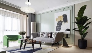 雅致的浅灰色沙发安置其中，简约时尚的绿色单位装点空间，呼应清新明快的背景墙。抽象的装饰元素由挂画延伸