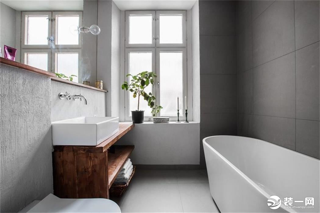 干湿分离的设计让洗手台成为另一种风格，与客餐厅呼应原木风，清新质朴，一面圆镜勾勒出空间格调。