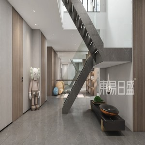 樓梯連接負一樓的樓梯采用鋼架結構和玻璃扶手設計，灰色與玻璃的搭配讓樓梯看起來簡單又高級。
