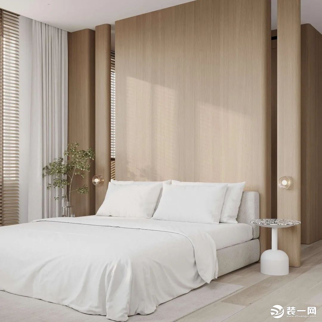 次卧凹陷的背景墙赋予单调的空间以立体感，精致的床头柜是素雅色调中的一抹重彩。深浅呼应、设计美学在生活