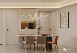 皮质+爱马仕橙+大理石的餐桌和餐边柜，让整个用餐区散发出一种温馨的氛围，浅浅的色调搭配线性吊灯，散发