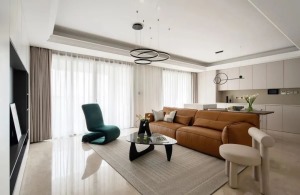 客厅，空间以现代舒适的氛围布置，整体以柔和奶茶色系奠定基调，搭配上精致舒适的软装家居，呈现出一种惬意