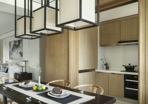 開放式廚房，木質板材的外延使得廚房與整體空間渾然一體。