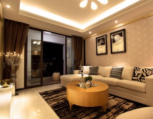 简洁，舒适的L型沙发，搭上黑框玻璃移门。整个空间说不出来的时尚，大方