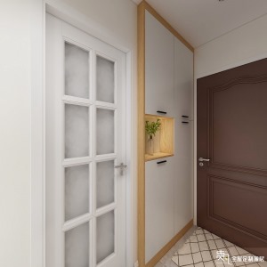 原本的入户空间是没有预留鞋柜的空间的，因为对户型进行了简单的改造，所以把入户厨房这一侧的墙体嵌入了一
