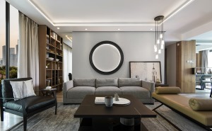 整体以白色与原木色调为主，浅灰色柔软的布艺沙发，与茶几简简单单的搭配，沙发背景墙的圆盘设计，展现空间