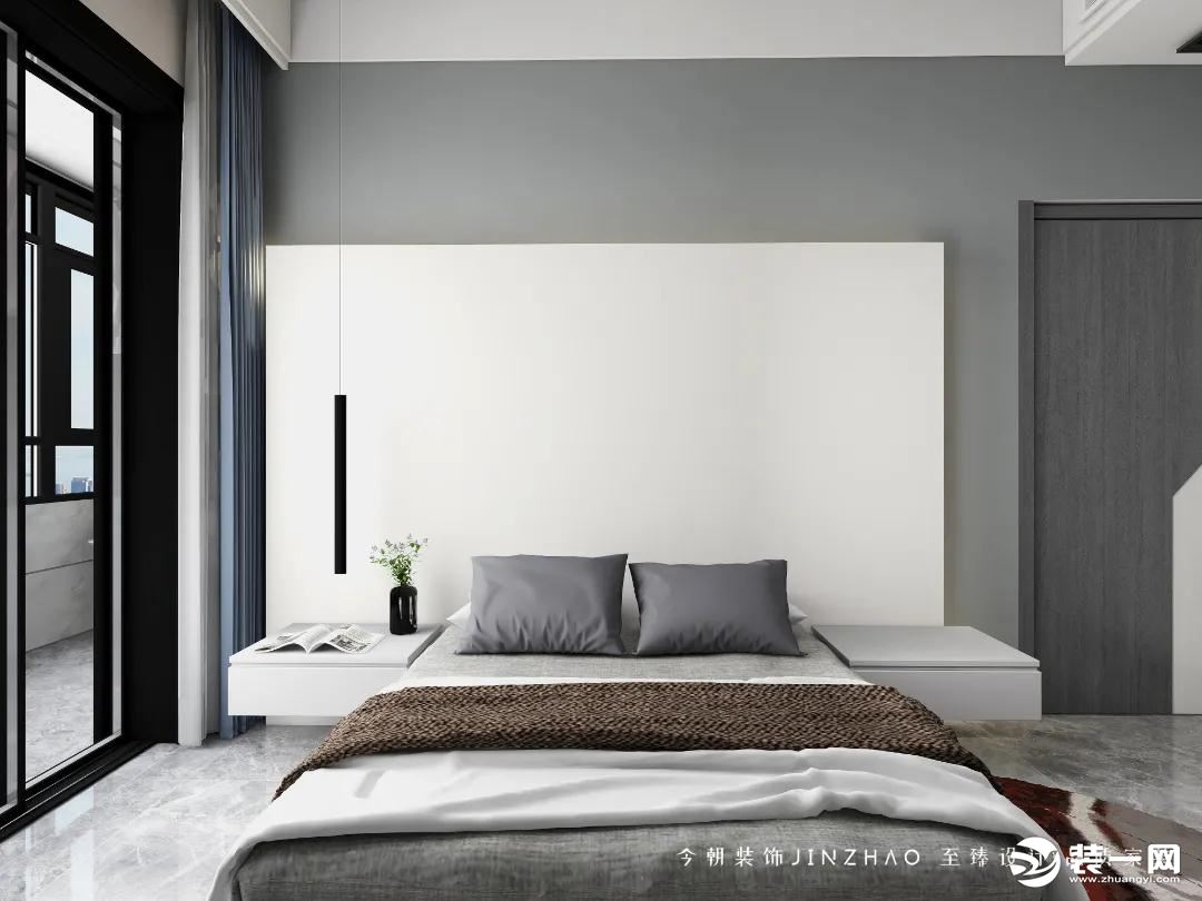 卧室空间也是以极简大方为主，净白的墙面天花，搭配灰白配的床单，呈现出一种简约舒适的高级与大方感