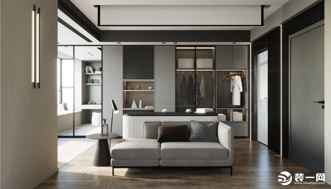 洁白简单的空间，没有多余的装饰，给人的是一种优雅干净的气息，大白墙的氛围下，摆有灰色沙发，黑色茶几，