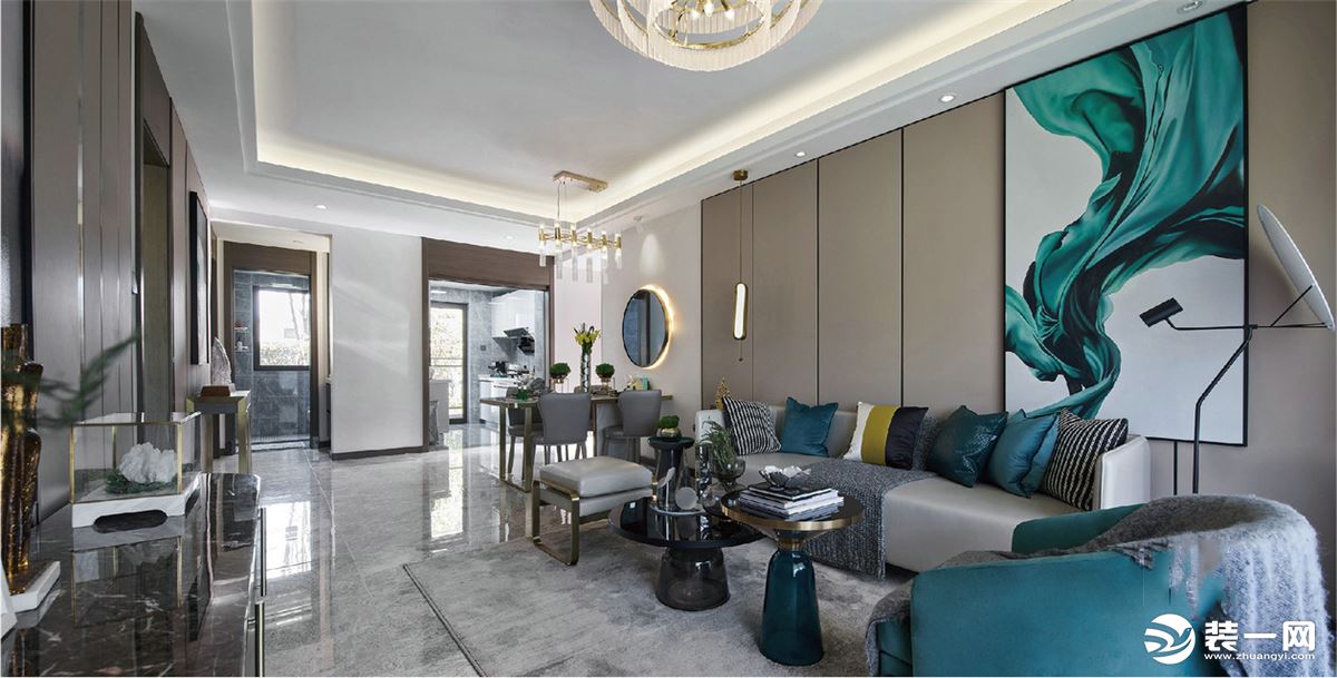 客厅舒适而放松，为背景墙披上温和的色调，配合精心选择的装饰挂画，整体和谐地衍生出一种品质感。
