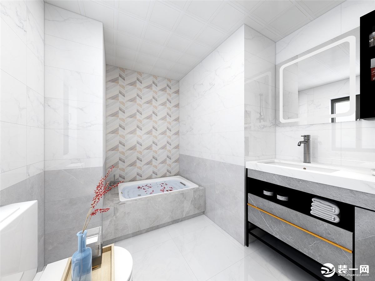 卫生间的灰白混色增加了空间的流动性，浴缸背景以拼接瓷砖为空间点缀暖色调，打破空间带来的冷色调。