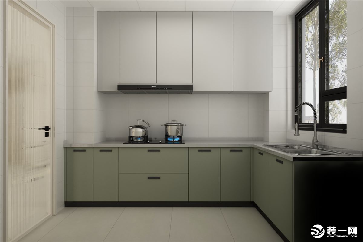厨房空间设计了“L”形橱柜，最大限度地增加操作面积。白色大理石的台面搭配淡绿灰的地柜，雅致干净