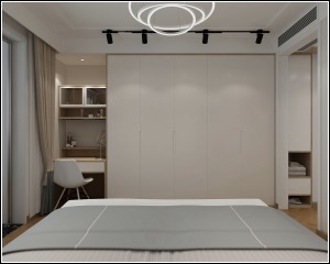 主卧室的设计采用淡暖色的感觉，床对面的墙面做成了一整面衣柜，增加了储物空间，也显得宽敞。