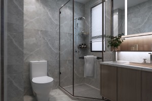 卫生间灰色瓷砖让整个空间充满了神秘感与层次感，淋浴房的设计让洗澡更加便利放心，整个空间让人舒适。