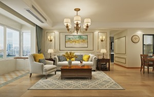 客厅沙发背景墙采用线条对称的形式，搭配上布艺沙发，柔和了空间。