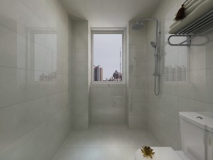 卫生间墙地砖均采用的暖色系的，增加空间的温馨感，马桶位也在原设计的位置做了调整，隔离出淋浴的区域。