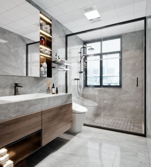墙地面通铺深色纹理的大理石，洁具选用简约款，淋浴房采用极简边框款式，仅由黑白构成的卫浴间显得十分干净