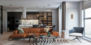 铁锈色彩的皮质沙发，浮雕的墙壁设计，像虎纹一样的地毯造型，低调品质