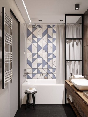 卫生间简约实用，浴缸以布帘隔断，拉开布帘，三角形的墙面砖，使得整个空间又呈现另一番格调。