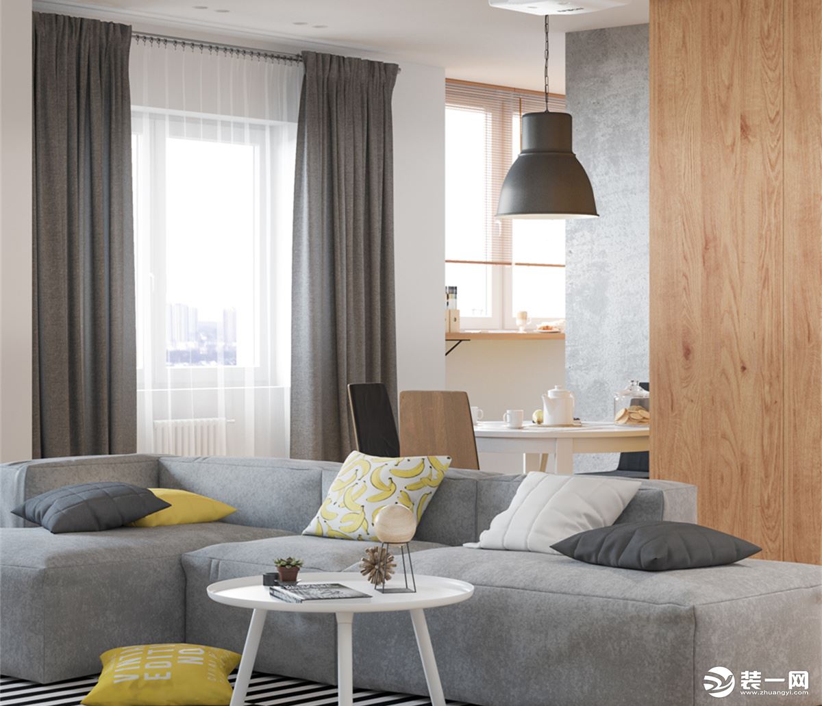 客厅以灰色布艺沙发的设计，柔软蓬松的质感，让你坐上去就感觉放松，黑白线条的地毯，也可以坐在上面