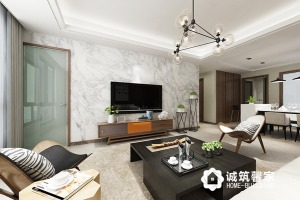客厅整个墙面铺贴石材作电视背景墙，空间更加明亮大气，与灰色家具搭配简洁舒适。