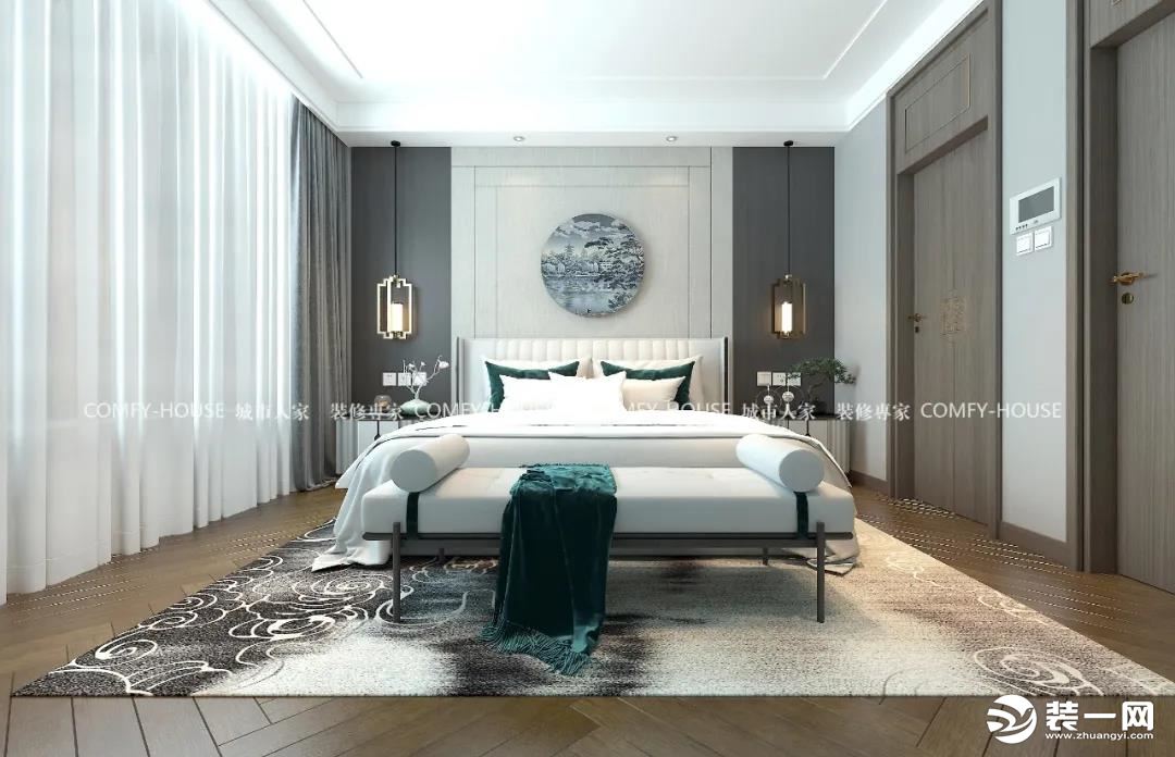 白色作为房间的主体 让室内的光线变得相当的明亮 床头两侧的对称壁灯 让这处空间洋溢着动人的中式美感