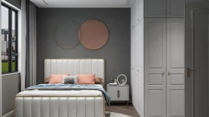 次卧是为父母偶尔过来小住而准备的房间，延续整体温馨的风格，灰色背景墙给人一种沉稳大气的感觉，乳白色床
