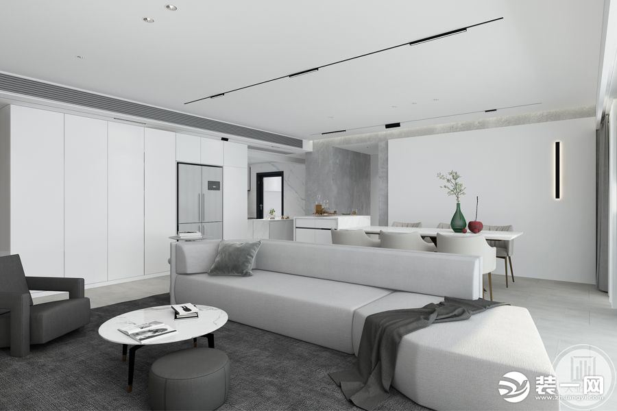 客厅使用大面积的纯白色，一字型的简约布艺沙发搭配富有质感的深灰色地毯、单人椅，黑白映衬间演绎舒朗的极