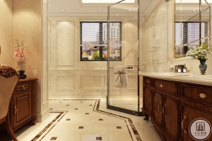 卫生间采用浅米色的基调，透明的玻璃门分离干湿空间，柜体增添收纳空间，波点的拼花地砖形成自然纹理，简洁